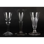 A MID 18TH CENTURY WINE GLASS with wrythen funnel bowl, on short stem and conical foot, 13.75cm, and