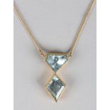 AN AQUAMARINE PENDANT, the faceted stones collet set in corresponding articulated box setting hung