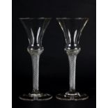 A PAIR OF MID 18TH CENTURY WINE GLASSES each bell shape bowl on an airtwist stem and conical foot,