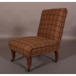 AN EDWARD VII NURSING CHAIR, upholstered in brown aubergine and fawn check, on turned front legs and