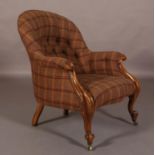 A VICTORIAN WALNUT ARMCHAIR, having a rounded back, buttoned upholstery in brown, aubergine and fawn