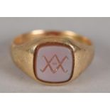 A VICTORIAN SARDONYX INTALIO SIGNET RING in 15ct gold, the double X engraved within a square with