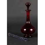 A 19TH CENTURY RUBY GLASS DECANTER with knop stopper, 18.5cm high together with a spiral clear and