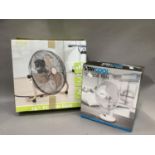 A 16" floor fan as new in original box together with a 12" desk fan, as new in box