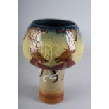 A MOORCROFT 'ABBOTS BROMLEY CHALICE' designed by Joe Hobbs, tube lined and painted in colours with