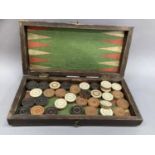 A late 19th century mahogany and blond wood games box, the interior lined with paper for