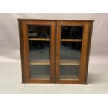 A Victorian walnut and glazed two door bookcase (top section only), 96cm wide x 27.5cm deep x 89cm
