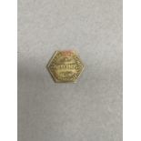 A Victorian penny token for Oaklands Preparatory school, Harrogate, hexagonal in shape