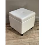 A cream leather effect stool with lift up top