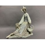 A Lladro figure of a Dutch girl sat resting her feet, her clogs and a basket of tulips beside her,