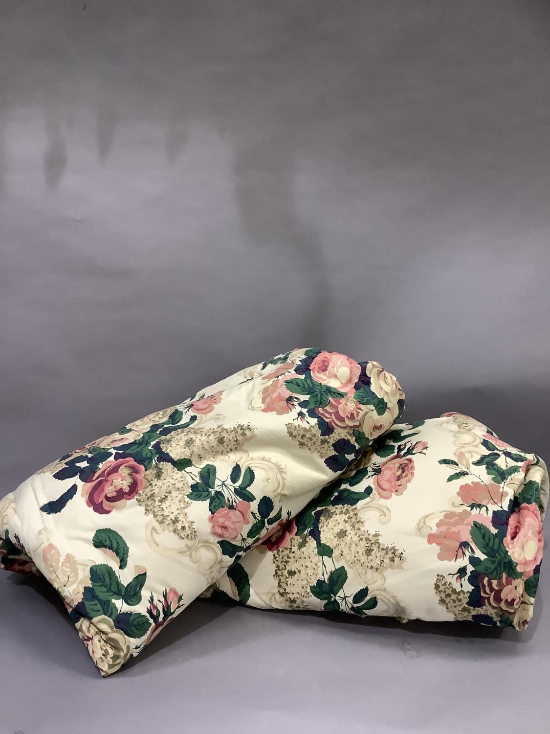 A pair of cotton curtains of floral design with bump linings