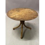 A late 19th century bentwood table, circular, on four curved legs and rounded feet