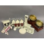 A doll's tin whisk and a pair of kitchen weighing scales, models of food and a suite of cream