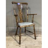 A stained beech kitchen chair with pierced splat and railed back, upholstered seat on turned legs