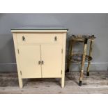 A 1930s/40s cream painted cabinet having a drawer above two door cupboard with chrome bar handles