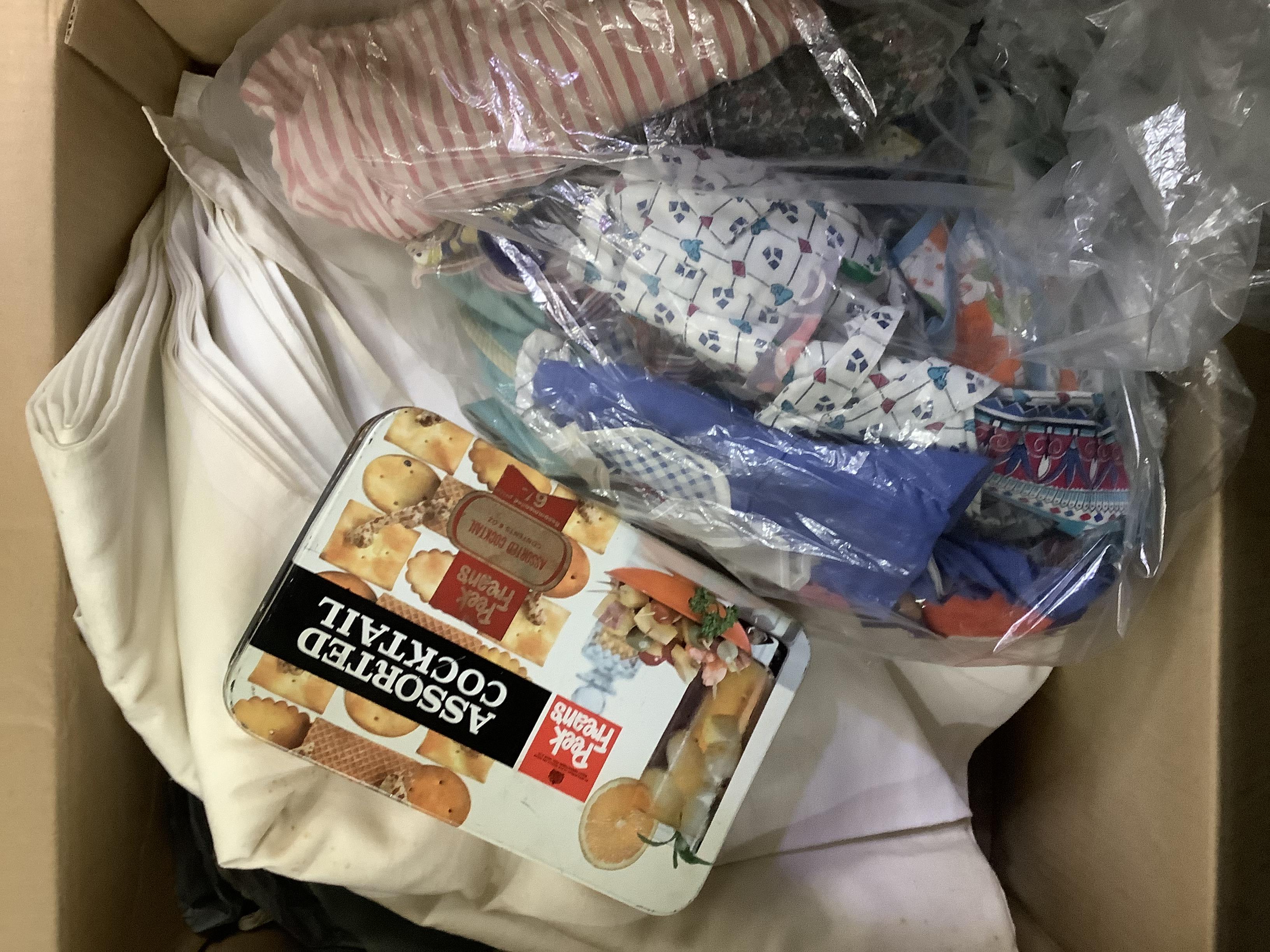 A quantity of fabric remnants, linens, sewing items