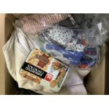A quantity of fabric remnants, linens, sewing items