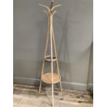 A modern laminated wood hat and coat stand with under tier