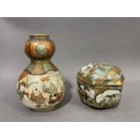 An early 20th century Japanese 'Satsuma' double gourd vase painted with figures watching a