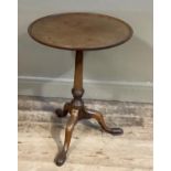 A 19th century mahogany tilt top table with tripod base and pad feet, 53cm diameter