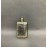 A silver spirit flask initialled MLG measuring 9.25m, London 1909, maker's mark for Charles and