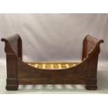 A 19th figured mahogany bateau-lit, scrolled end panels, one mahogany curved side panel, with