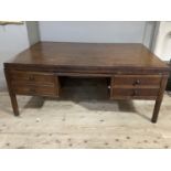 A mahogany desk inlaid with ebonised stringing having two drawers to either side of a kneehole,