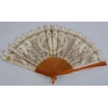 A very unusual c 1900 fan with a mix of Brussels needle lace and sequins, the blonde