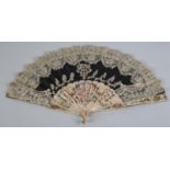 A good brussels needle lace fan c 1860's, the pink Mother of Pearl monture pierced, silvered and