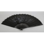 Bats! Circa 1890's, a large wood fan with incised monture, the black crepe leaf with machine lace