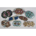 A selection of 1920's to 1940's enamel belt buckles, in various shapes and colours, plus one very