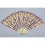 An 18th century fan with carved and pierced bone sticks, these and the double leaf painted in