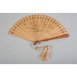 An early 20th century Japanese bamboo brisé fan, the guards a deeper shade and polished, both