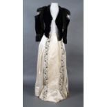 Edwardian costume, comprising two cream silk full length trained skirts and a boned, deep