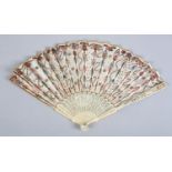 A Regency ivory fan, the monture carved and pierced, a cartouche containing Cupid in the gorge,