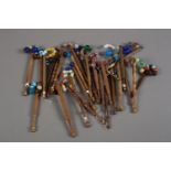 Lace bobbins: twenty-six turned wood bobbins of different designs, all spangled, plus two quite