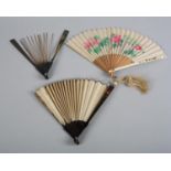 An early 19th century tortoiseshell fan, the monture plain, mounted with a cream silk leaf, some