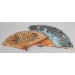 A 19th century Japanese wood brise fan, the guards polished or lacquered, lightly decorated with