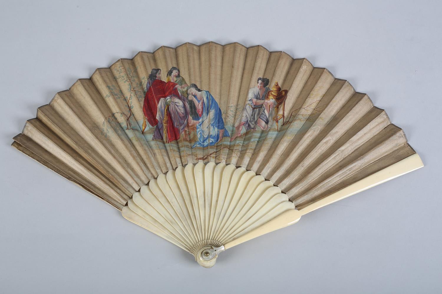 An 18th century ivory fan, the head fairly bulbous and fitted with a mother of pearl thumb guard,