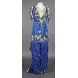 A formal Edwardian evening gown, trained, royal blue figured silk with a blue chiffon overskirt,