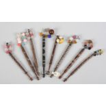 Lace bobbins: eight in dark wood, one with metal inlay, four with bobbles, one with metal twists,