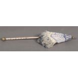 C 1830's, a small parasol with fully beaded cover, woven with opaque and navy-blue glass beads,