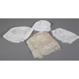 19th century whitework: four examples of whitework embroidery, the smallest being a baby bonnet with