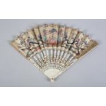 An 18th century ivory fan of rather theatrical appearance, the double leaf with a central