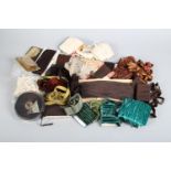 A large quantity of vintage velvet or silk ribbons, many narrow, in shades of green, cream, rust,