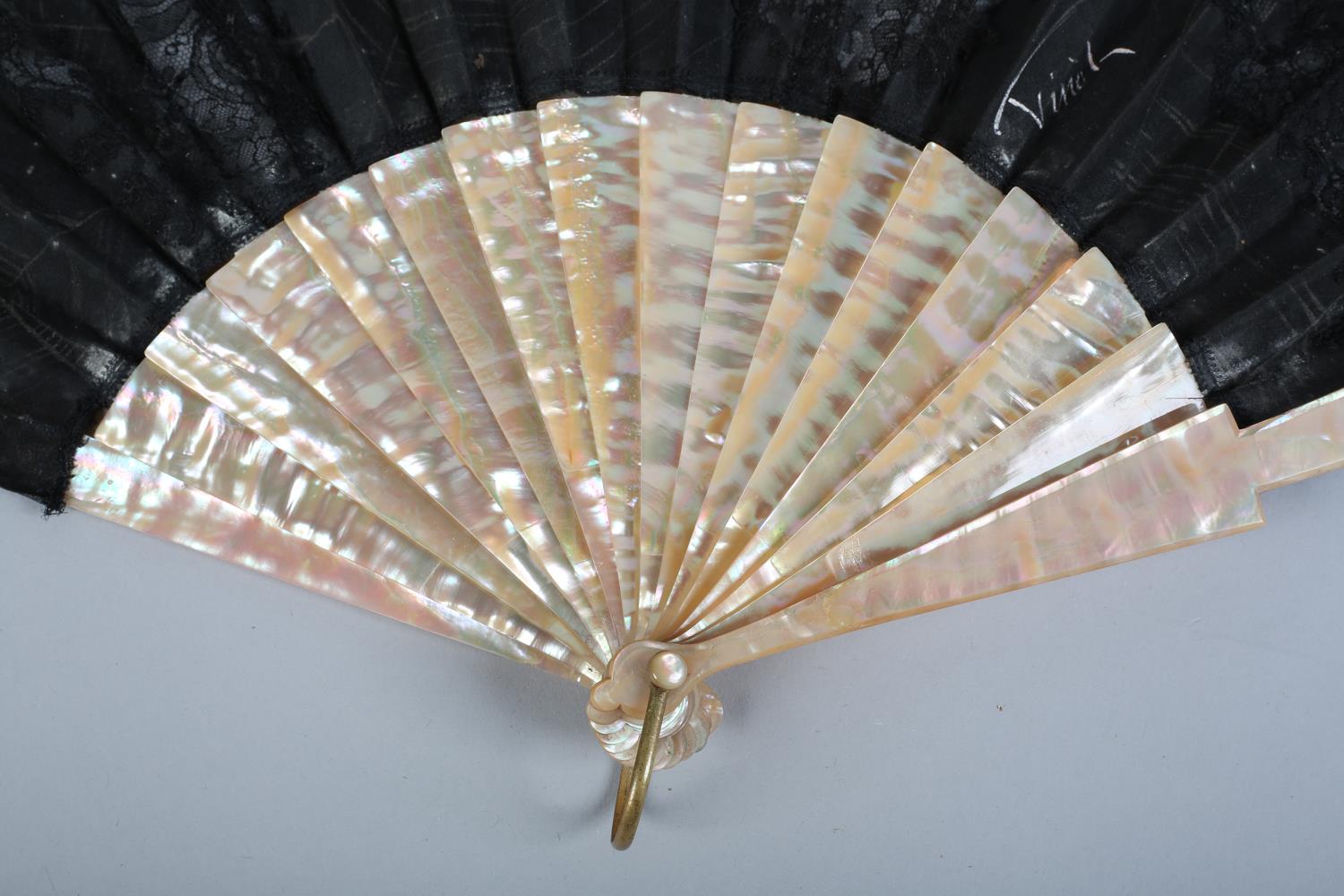 A circa 1880's fan with plain but striking pink mother of pearl monture, the black gauze leaf - Image 2 of 5