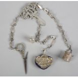 Silver metal chatelaine, elector plate, with thimble and bucket, scissors, and pincushion.