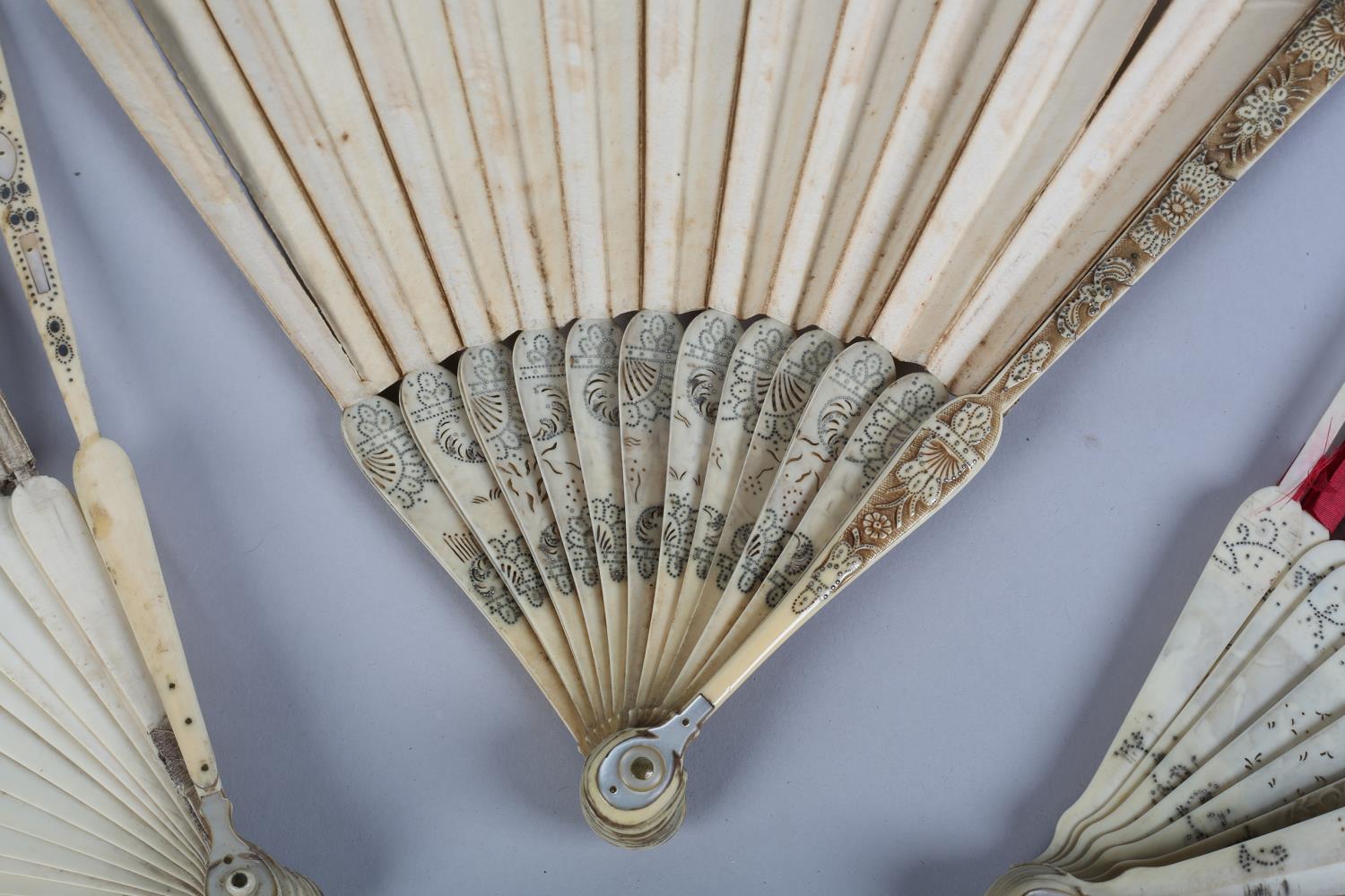 Three early 18th century ivory fans with bulbous heads and particularly unusual montures, the - Image 3 of 7