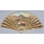 A 19th century bone fan, highly decorated, the monture carved and pierced and painted in strong
