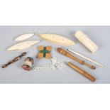A selection of needle work tools, to include three tatting shuttles of varying sizes; a bone bobbin;